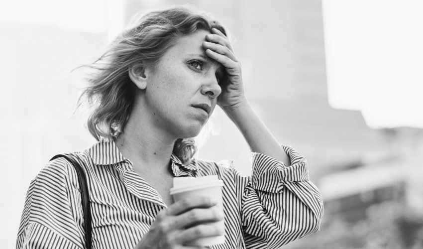 Tensed woman is late for work