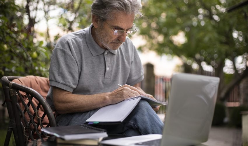 senior-man-doing-online-classes-laptop