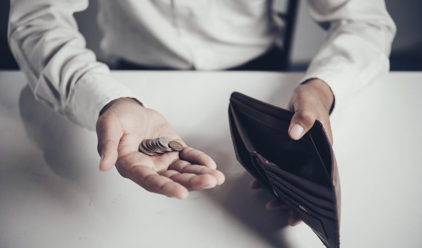 businessman saving money,Man carrying a wallet in hand, the doll