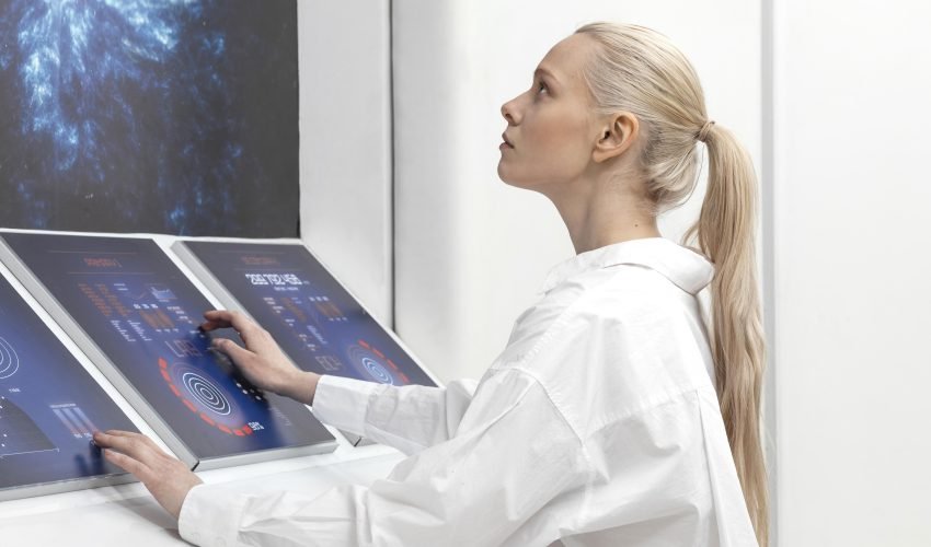side-view-woman-working-digital-monitors