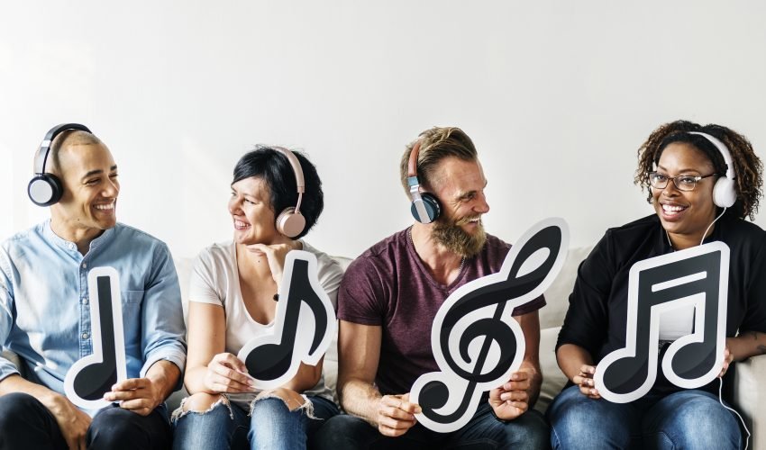People holding musical icons