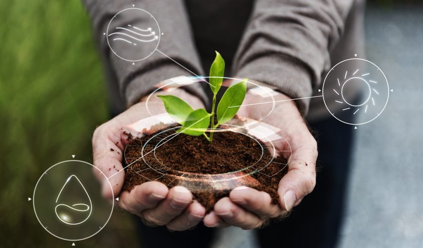 Smart agriculture IoT with hand planting tree background